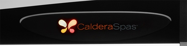 A close-up image of the lighted Caldera logo outside our hot tubs that indicates spa readiness