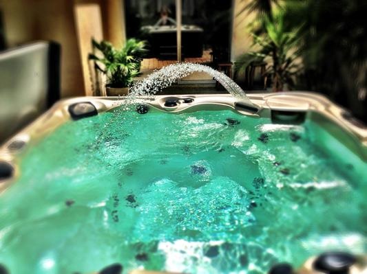 A caldera hot tub with acquarella water fountain feature