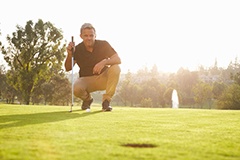 image of a man looking down the putting green for the best possible shot
