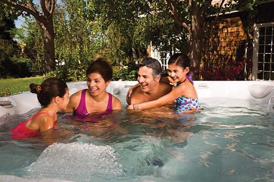 family enjoys quality family time in a cold water hot tub