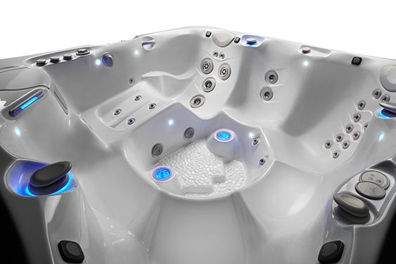 The interior of a Caldera spa without water to demonstrate that lighting has been applied to all controls to help you find them in the dark