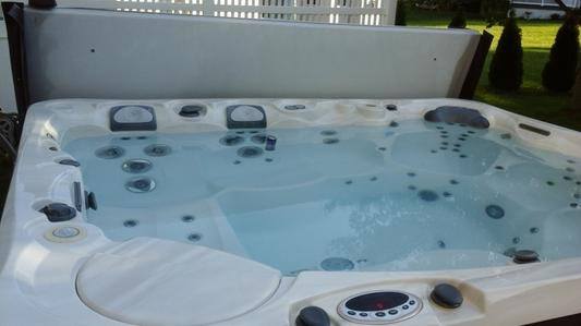 a Caldera hot tub sits with the power turned off getting ready to have the water recycled
