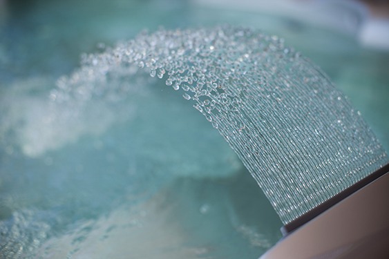 Image of a hot tub waterfall water feature close-up