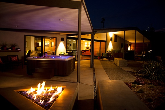 Image of a hot tub on a beautiful modern style backyard at night