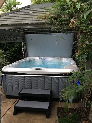 the newest model of the utopia geneva hot tub fits any backyard decor design