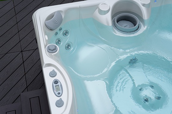 overhead view of a hot tub filled with water and hot tub water maintenance discussion